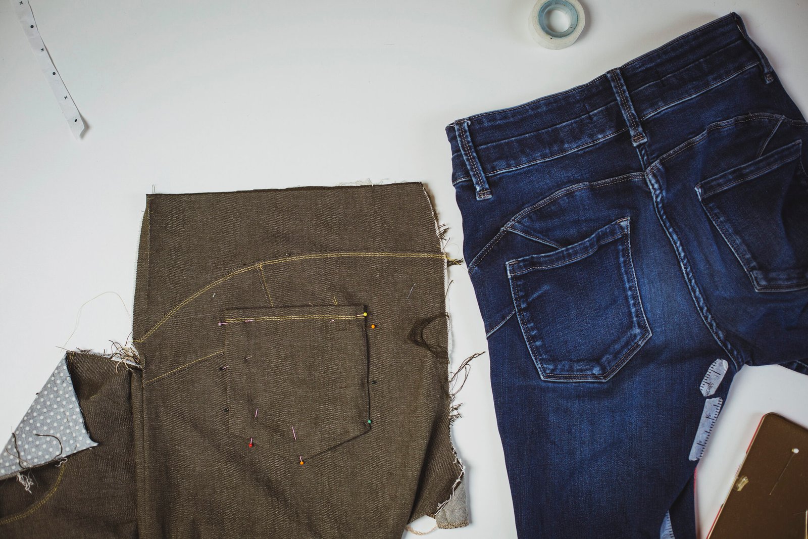 Original jeans next to a recreated version in progress, showing the back pocket details being copied during a Thimble Studios Copy Your Wardrobe class